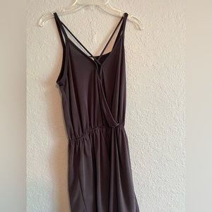 Short romper with pockets. Fits like an extra small. Very comfortable.